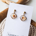 Ohrringe mit Herzmuscheln - Gold