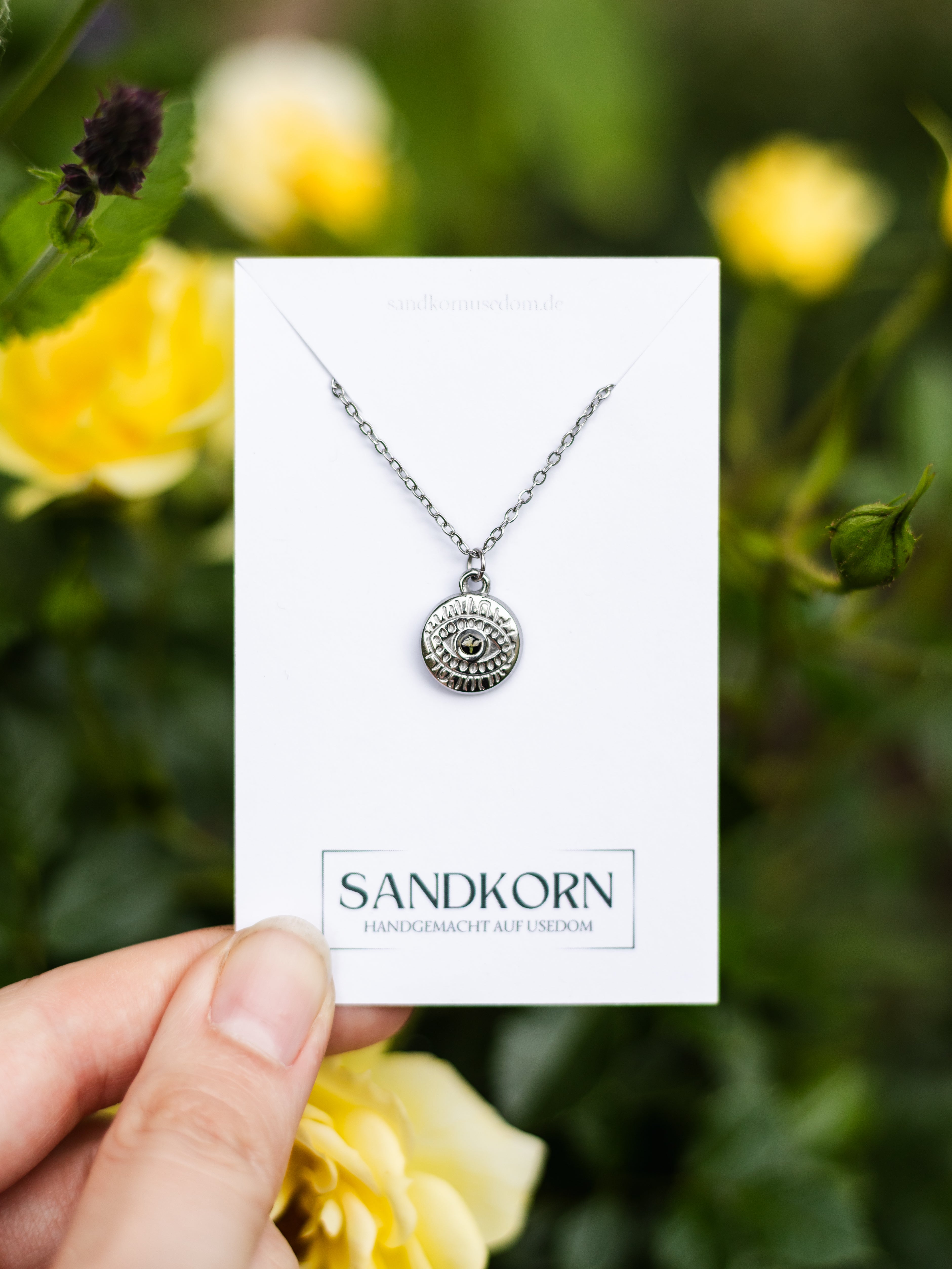 Necklace with eye and wild carrot