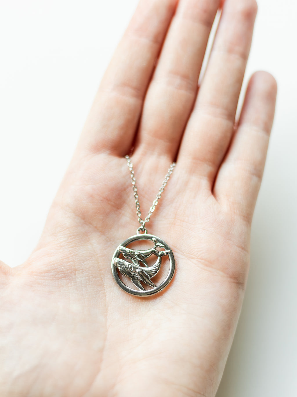 Necklace with two humpback whales