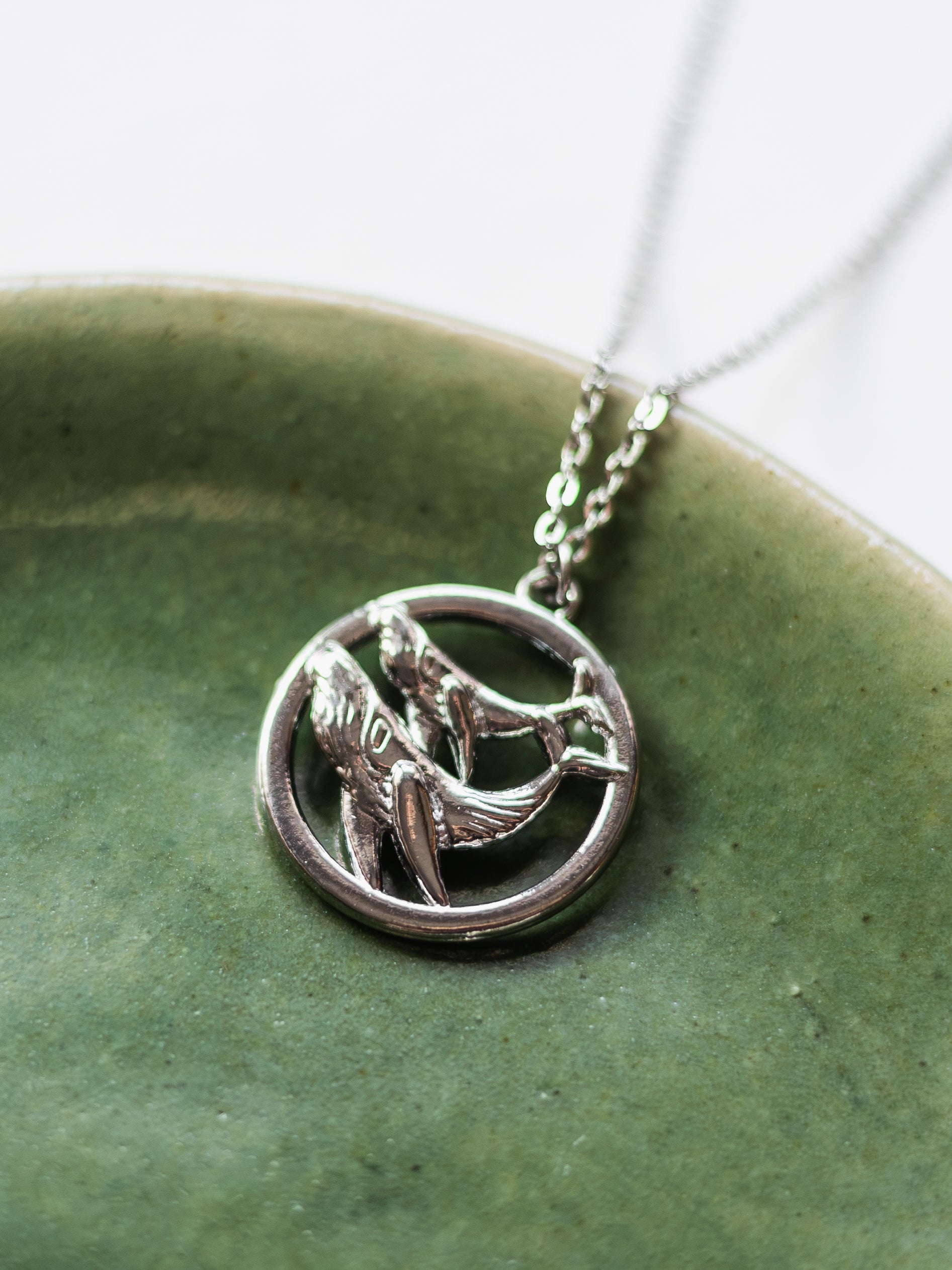 Necklace with two humpback whales