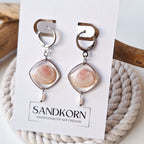 Earrings with cockle shells and freshwater pearls