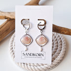 Earrings with cockle shells and freshwater pearls