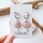 Earrings with cockle shells and freshwater pearls