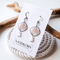 Earrings with seashells and freshwater pearls