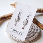 Earrings with cockle shells and freshwater pearls