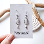 Earrings with cockle shells and freshwater pearls