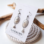 Earrings with cockle shells and freshwater pearls