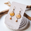 Earrings with seashells and freshwater pearls