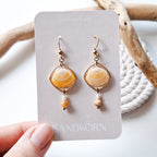 Earrings with seashells and freshwater pearls