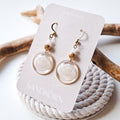 Earrings with seashells and freshwater pearls
