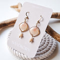 Earrings with seashells and freshwater pearls