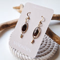 Earrings with cockle shells and freshwater pearls