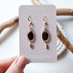 Earrings with cockle shells and freshwater pearls