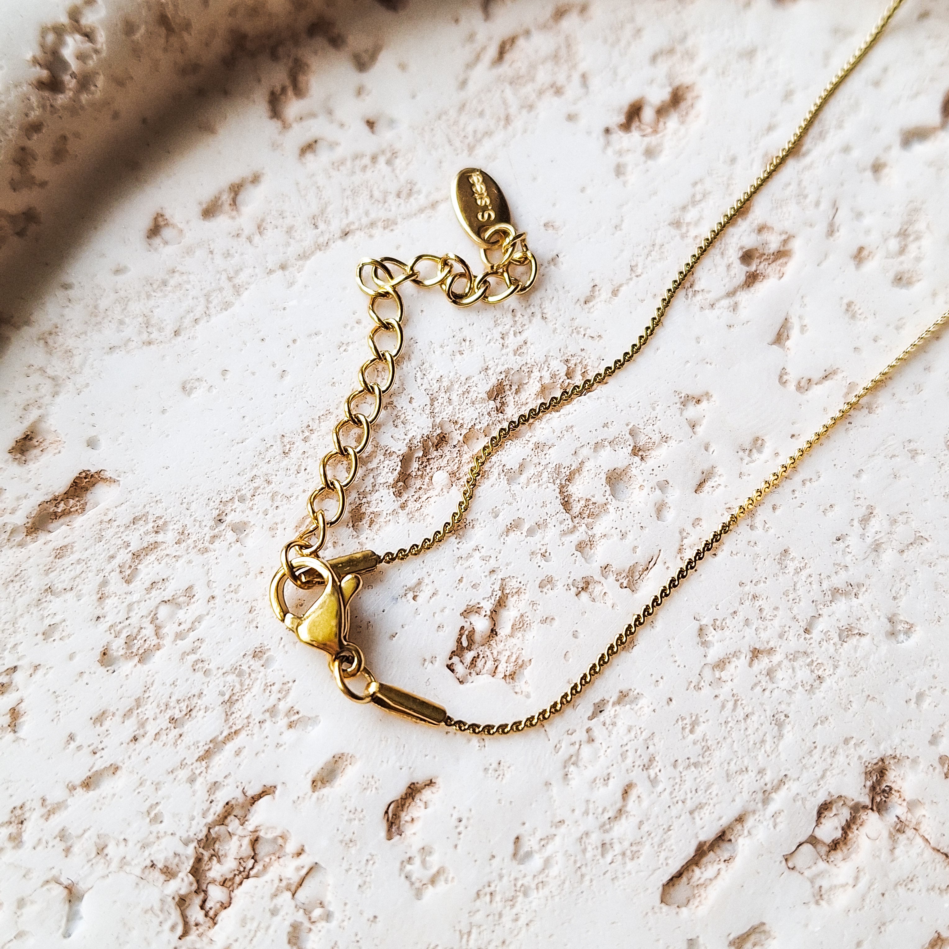 Halskette mit Herzmuschel - Gold