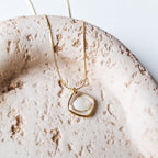 Halskette mit Herzmuschel - Gold